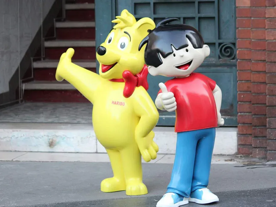 Two brand character statues in resin